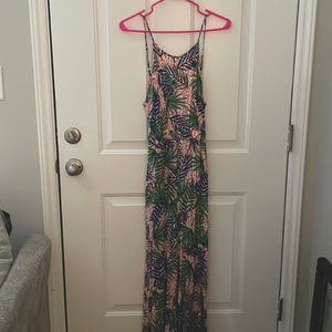 Jumpsuit with adjustable straps. Open back with tie.